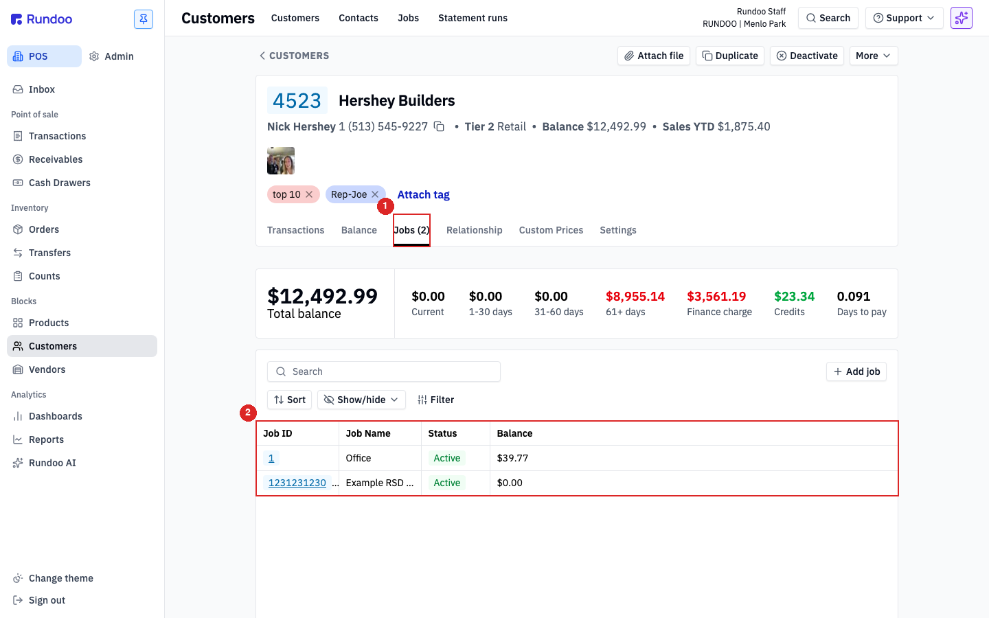 A customer's Jobs sub-tab showing the balance summary and a per-job balance table